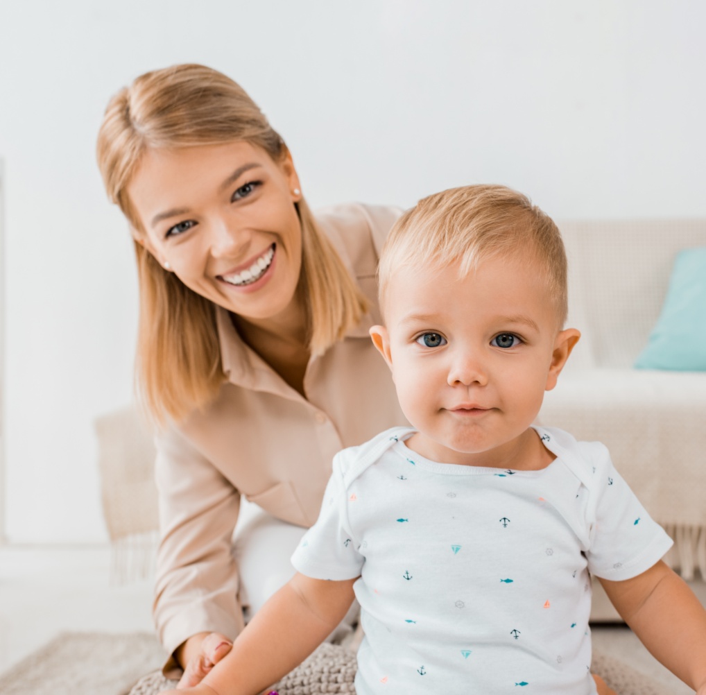 adorable-toddler-looking-at-camera-with-mother-in-2023-11-27-05-29-46-utc