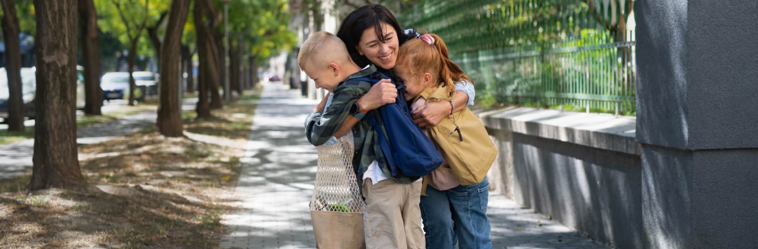 happy-schoolchildren-hugging-their-grandmother-wai-2023-11-27-05-34-47-utc (1)