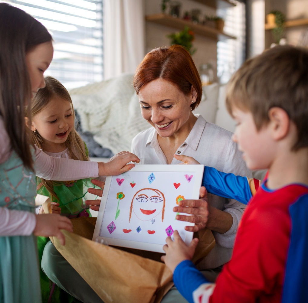mother-of-little-children-in-costumes-getting-pres-2023-11-27-05-23-36-utc